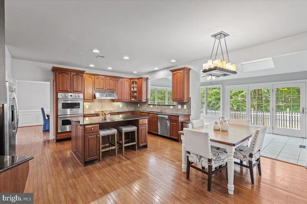 Chandelier, Dining room, Interior, Kitchen, Recessed Lighting, Stainless Steel Appliances, Wood Texture Flooring