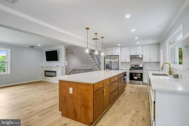 Fireplace, Interior, Kitchen, Pendant Lights, Recessed Lighting, Stainless Steel Appliances, Wood Texture Flooring