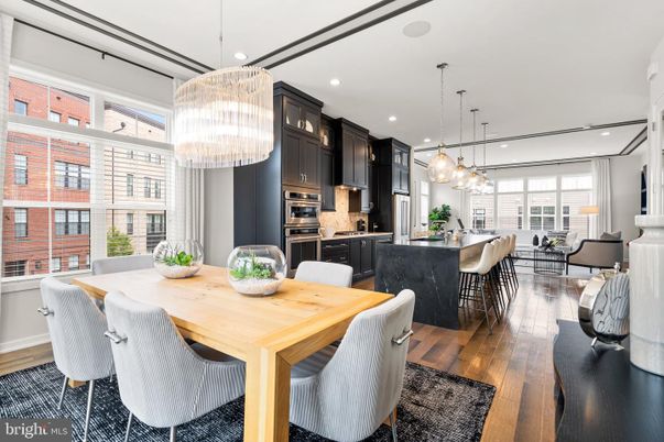 Chandelier, Dining room, Interior, Kitchen, Living room, Pendant Lights, Recessed Lighting, Stainless Steel Appliances, Wood Texture Flooring