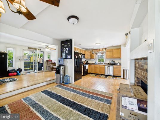 Fireplace, Interior, Kitchen, Pendant Lights, Stainless Steel Appliances, Wood Texture Flooring
