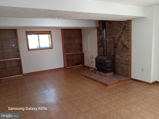 Empty room, Fireplace, Interior, Stone Walls, Wood Texture Flooring