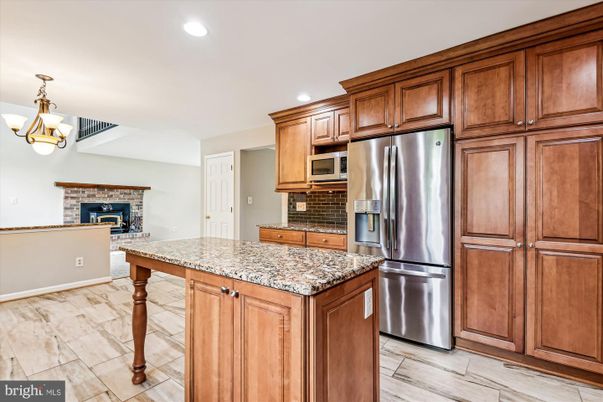 Fireplace, Interior, Kitchen, Pendant Lights, Recessed Lighting, Stainless Steel Appliances, Wood Texture Flooring