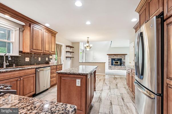 Chandelier, Fireplace, Interior, Kitchen, Marble, Recessed Lighting, Stainless Steel Appliances