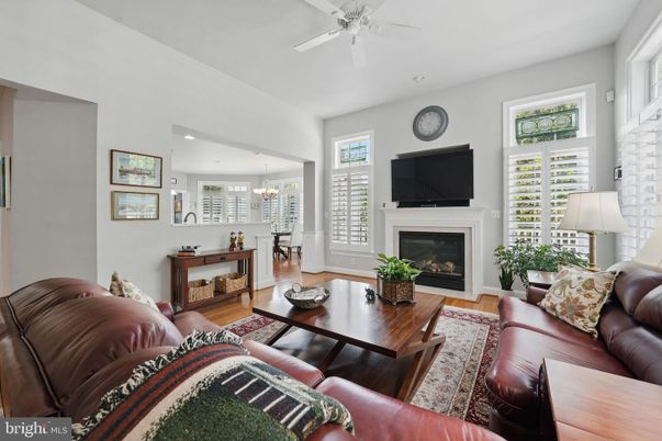 Chandelier, Dining room, Fireplace, Interior, Living room, Pendant Lights, Recessed Lighting, Wood Texture Flooring