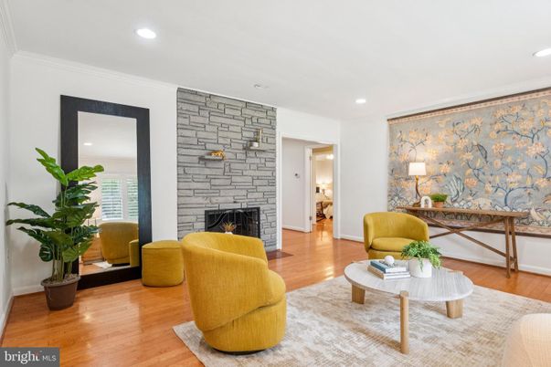 Fireplace, Interior, Living room, Recessed Lighting, Stone Walls, Wood Texture Flooring