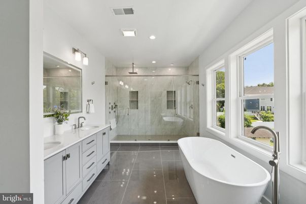 Bathroom, Dual Sink Vanities, Free Standing Baths, Glass Shower, Interior, Marble Walls, Recessed Lighting