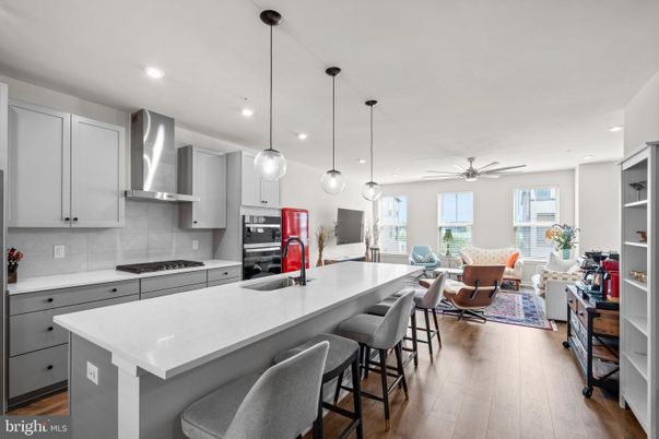 Dining room, Interior, Kitchen, Pendant Lights, Recessed Lighting, Stainless Steel Appliances, Wood Texture Flooring