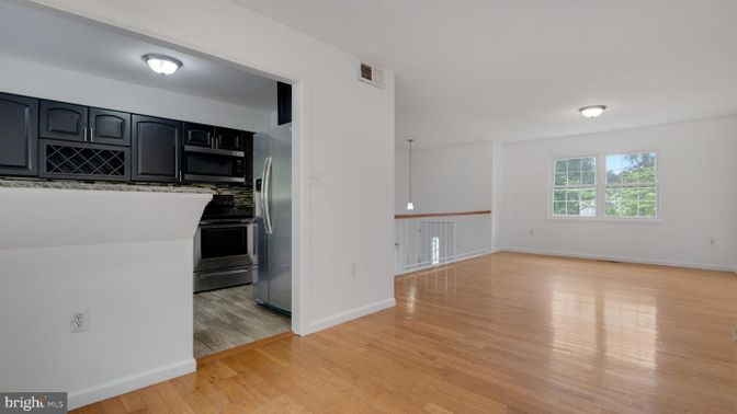 Empty room, Interior, Kitchen, Stainless Steel Appliances, Wood Texture Flooring