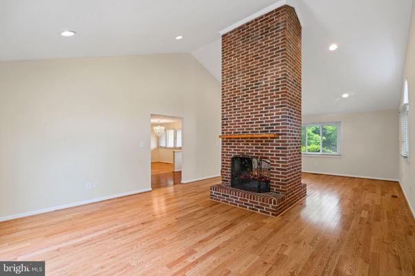 Empty room, Fireplace, Interior, Recessed Lighting, Stone Walls, Wood Texture Flooring