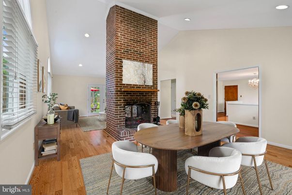 Dining room, Fireplace, Interior, Recessed Lighting, Stone Walls, Wood Texture Flooring