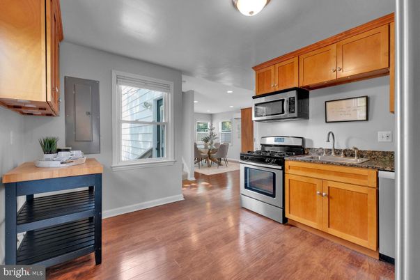 Dining room, Interior, Kitchen, Recessed Lighting, Stainless Steel Appliances, Wood Texture Flooring