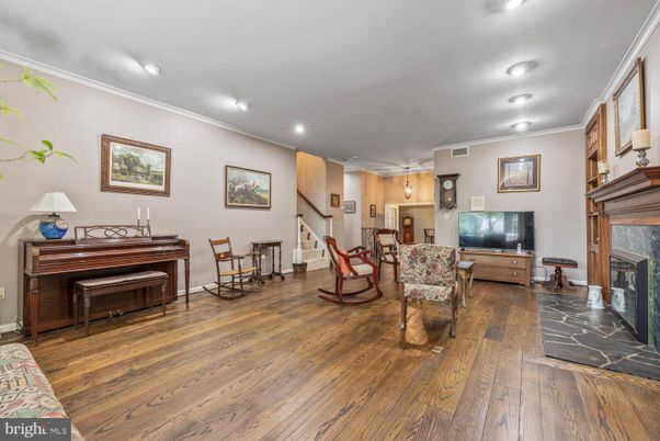 Fireplace, Interior, Living room, Piano, Recessed Lighting, Wood Texture Flooring