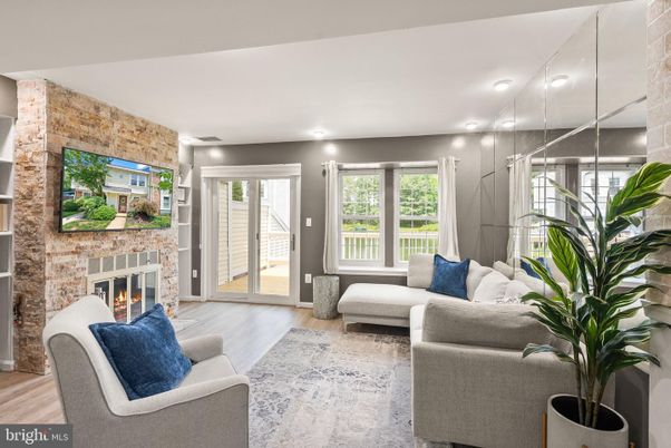 Fireplace, Interior, Living room, Recessed Lighting, Stone Walls, Wood Texture Flooring