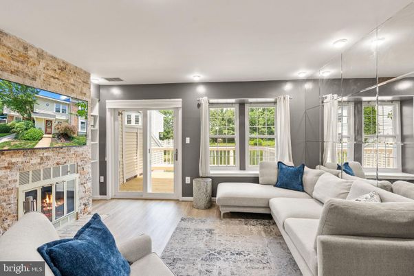 Fireplace, Interior, Living room, Recessed Lighting, Stone Walls, Wood Texture Flooring