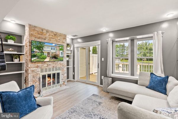 Fireplace, Interior, Living room, Recessed Lighting, Stone Walls, Wood Texture Flooring