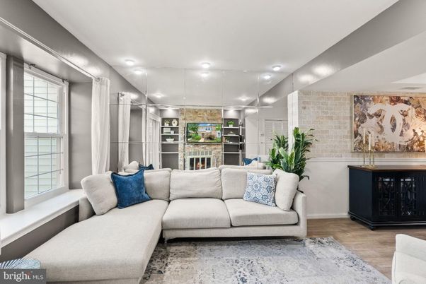 Fireplace, Interior, Living room, Recessed Lighting, Stone Walls, Wood Texture Flooring