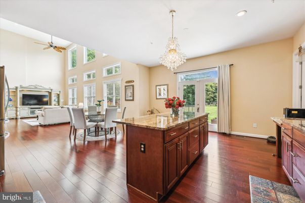 Chandelier, Dining room, Fireplace, Interior, Kitchen, Living room, Recessed Lighting, Wood Texture Flooring