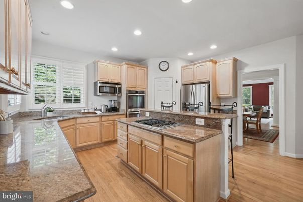 Dining room, Interior, Kitchen, Recessed Lighting, Stainless Steel Appliances, Wood Texture Flooring