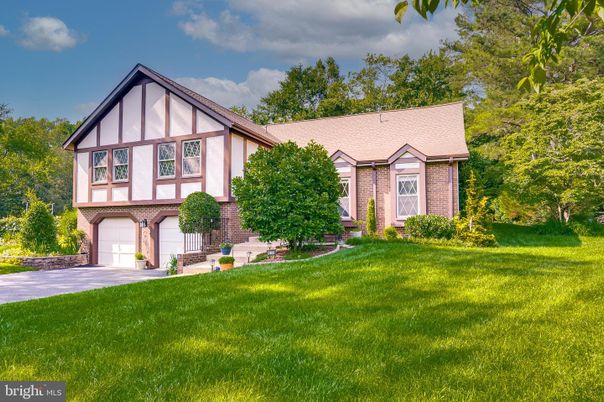Attached, Backyard, Exterior, Facade, Brick Facade, Tudor Revival