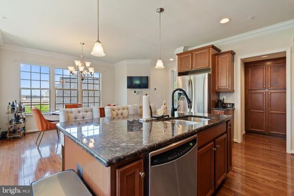 Chandelier, Dining room, Interior, Kitchen, Pendant Lights, Recessed Lighting, Stainless Steel Appliances, Wood Texture Flooring