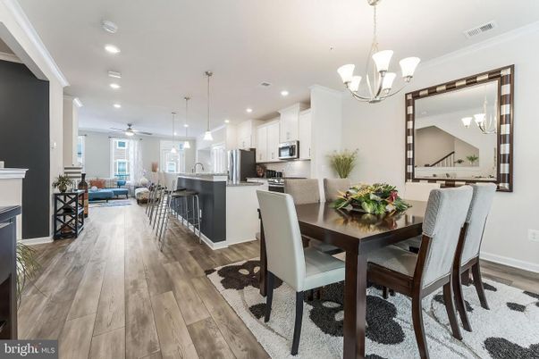 Chandelier, Dining room, Interior, Kitchen, Living room, Pendant Lights, Recessed Lighting, Stainless Steel Appliances, Wood Texture Flooring