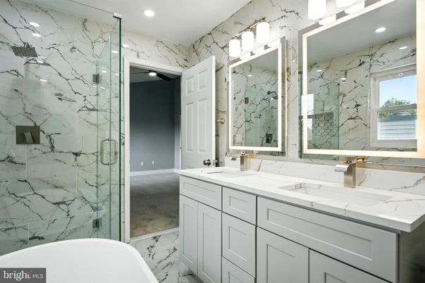 Bathroom, Dual Sink Vanities, Free Standing Baths, Glass Shower, Interior, Marble, Marble Walls, Recessed Lighting