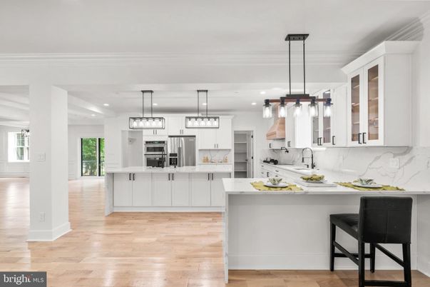 Interior, Kitchen, Marble Walls, Pendant Lights, Recessed Lighting, Stainless Steel Appliances, Wood Texture Flooring