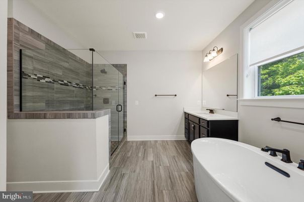 Bathroom, Dual Sink Vanities, Glass Shower, Interior, Recessed Lighting, Wood Texture Flooring
