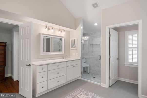 Bathroom, Dual Sink Vanities, Glass Shower, Interior, Recessed Lighting, Wood Texture Flooring