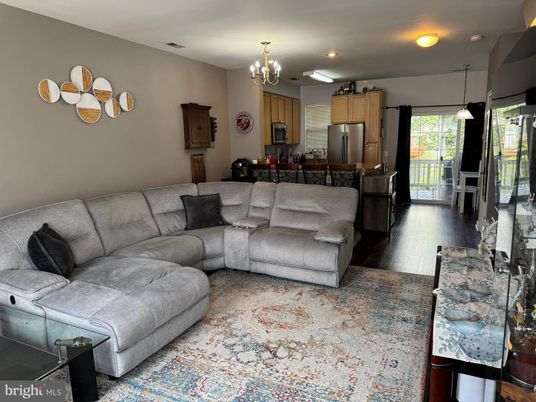 Chandelier, Interior, Kitchen, Living room, Pendant Lights, Recessed Lighting, Stainless Steel Appliances, Wood Texture Flooring