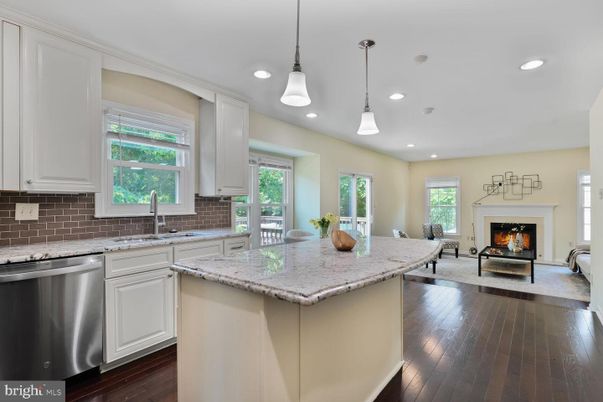 Fireplace, Interior, Kitchen, Pendant Lights, Recessed Lighting, Stainless Steel Appliances, Wood Texture Flooring