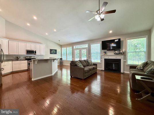 Fireplace, Interior, Kitchen, Living room, Pendant Lights, Recessed Lighting, Stainless Steel Appliances, Wood Texture Flooring