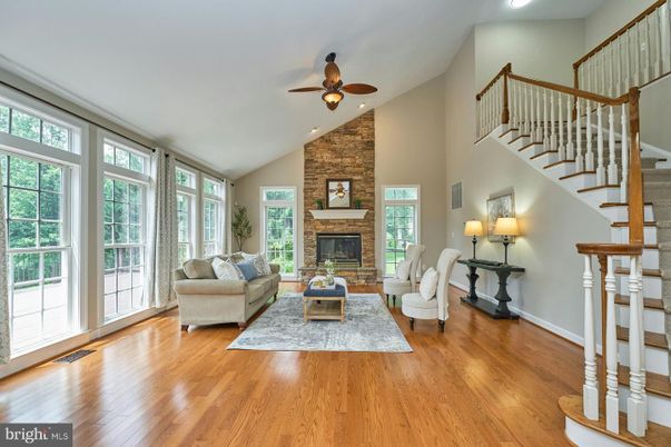 Fireplace, Interior, Living room, Recessed Lighting, Stone Walls, Wood Texture Flooring
