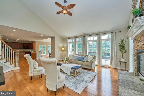 Fireplace, Interior, Kitchen, Living room, Recessed Lighting, Stainless Steel Appliances, Stone Walls, Wood Texture Flooring
