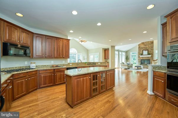 Fireplace, Interior, Kitchen, Living room, Recessed Lighting, Wood Texture Flooring
