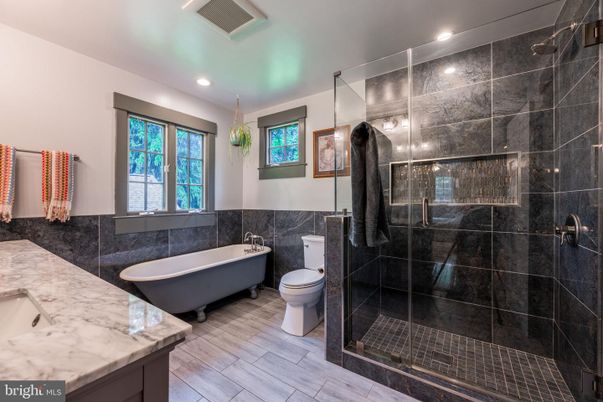 Bathroom, Free Standing Baths, Glass Shower, Interior, Recessed Lighting, Wood Texture Flooring