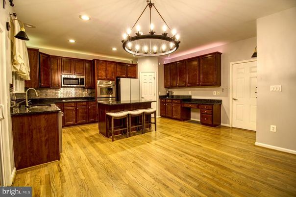 Chandelier, Interior, Kitchen, Recessed Lighting, Stainless Steel Appliances, Wood Texture Flooring