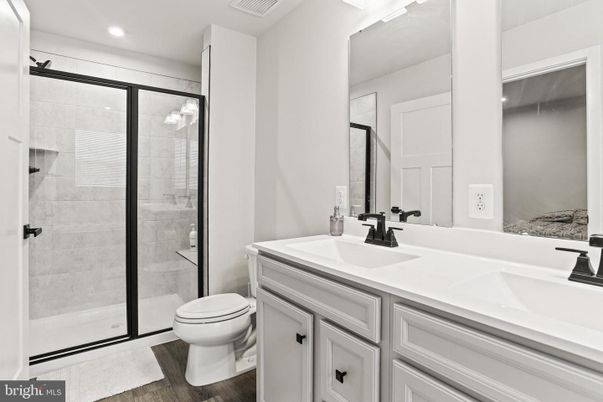 Bathroom, Dual Sink Vanities, Glass Shower, Interior, Recessed Lighting, Wood Texture Flooring