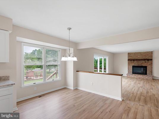 Empty room, Fireplace, Interior, Pendant Lights, Stone Walls, Wood Texture Flooring