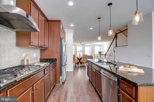 Dining room, Interior, Kitchen, Pendant Lights, Recessed Lighting, Stainless Steel Appliances, Wood Texture Flooring