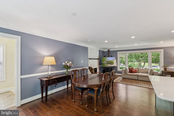 Dining room, Fireplace, Interior, Living room, Recessed Lighting, Wood Texture Flooring