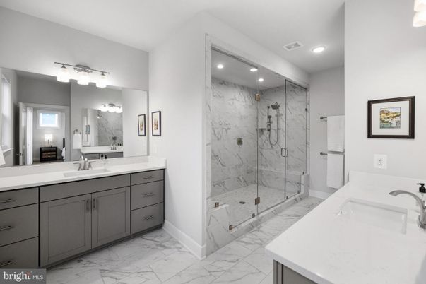 Bathroom, Dual Sink Vanities, Glass Shower, Interior, Marble, Marble Walls, Recessed Lighting
