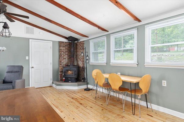 Dining room, Fireplace, Interior, Stone Walls, Wooden Beams, Wood Texture Flooring