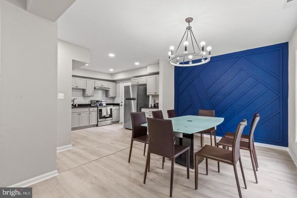 Chandelier, Dining room, Interior, Kitchen, Pendant Lights, Recessed Lighting, Stainless Steel Appliances, Wood Texture Flooring