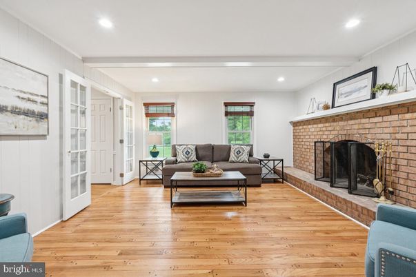 Fireplace, Interior, Living room, Recessed Lighting, Stone Walls, Wood Texture Flooring