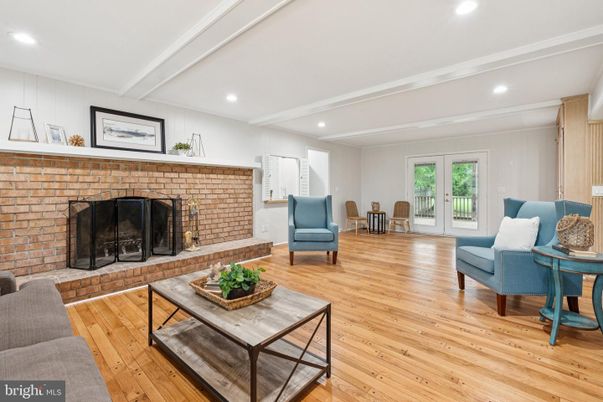 Fireplace, Interior, Living room, Recessed Lighting, Stone Walls, Wood Texture Flooring