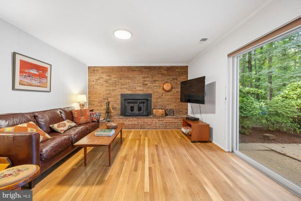 Fireplace, Interior, Living room, Recessed Lighting, Stone Walls, Wood Texture Flooring