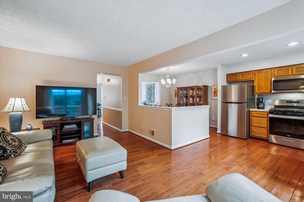 Chandelier, Dining room, Interior, Kitchen, Living room, Recessed Lighting, Stainless Steel Appliances, Wood Texture Flooring