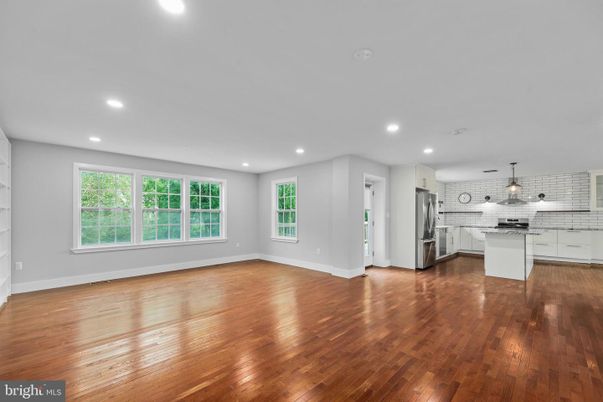 Empty room, Interior, Kitchen, Pendant Lights, Recessed Lighting, Stainless Steel Appliances, Wood Texture Flooring