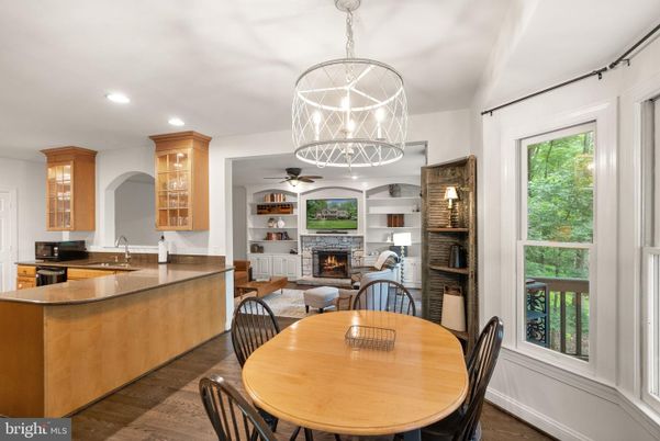 Dining room, Fireplace, Interior, Living room, Pendant Lights, Recessed Lighting, Wood Texture Flooring